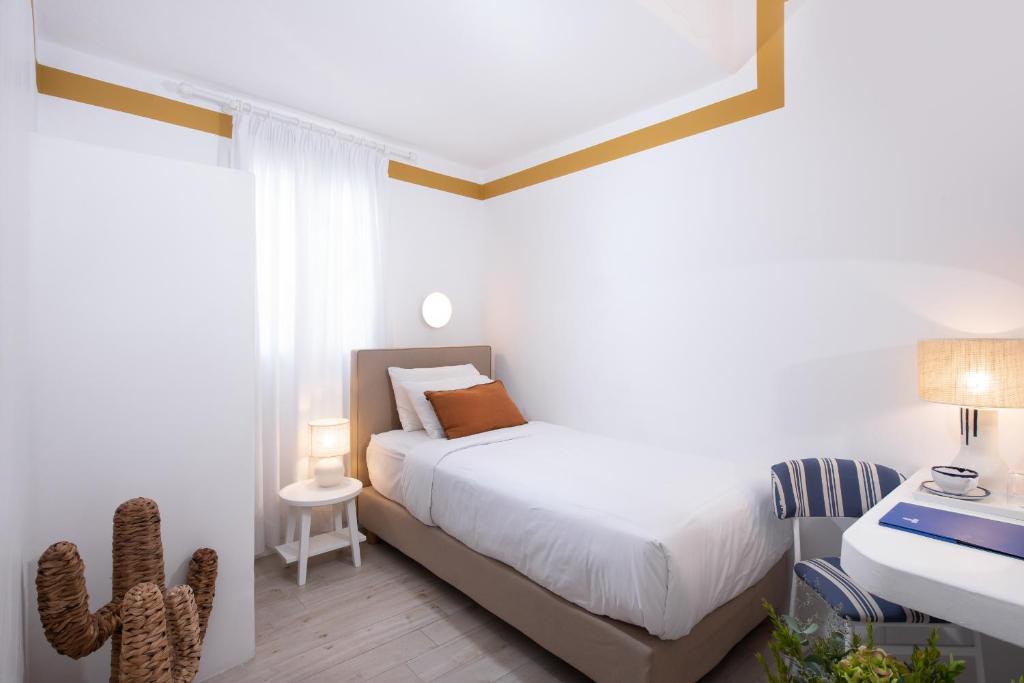 Posteľ alebo postele v izbe v ubytovaní Hotel Tagoo