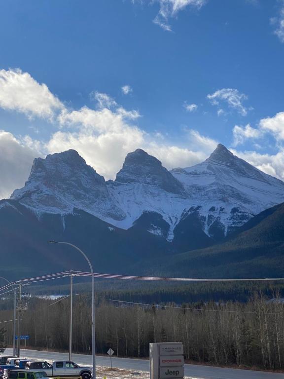 a view of a snow covered mountain range at Cozy 1 bedroom Apartment Canmore / Banff in Canmore