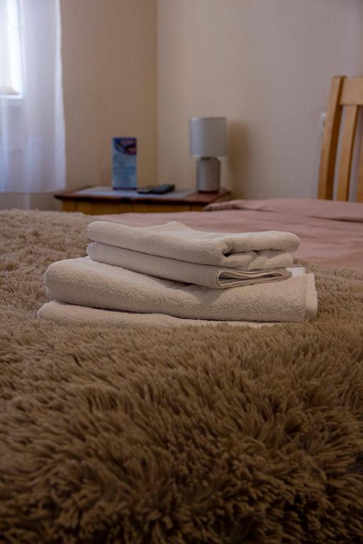 Postel nebo postele na pokoji v ubytování Olimpija Hotel & SPA