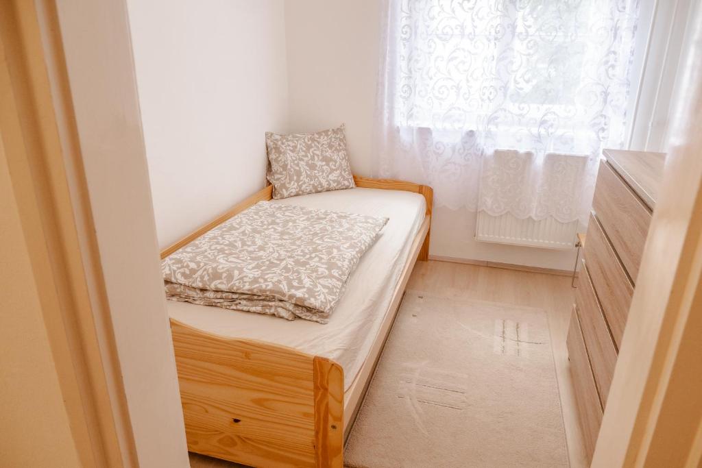Posteľ alebo postele v izbe v ubytovaní Király40 Apartman