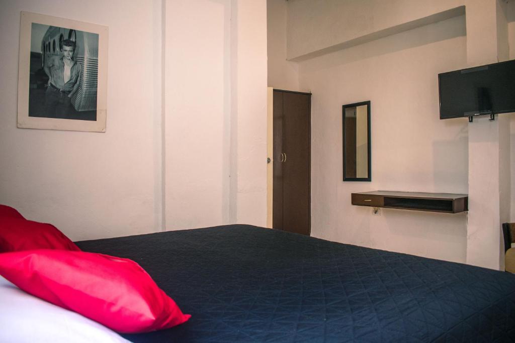 Postel nebo postele na pokoji v ubytování Hotel Cupules