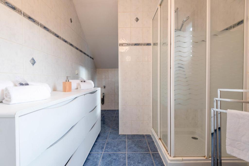 a bathroom with a shower and a sink at Pleasant apartment three minutes from the center of Annecy in Annecy