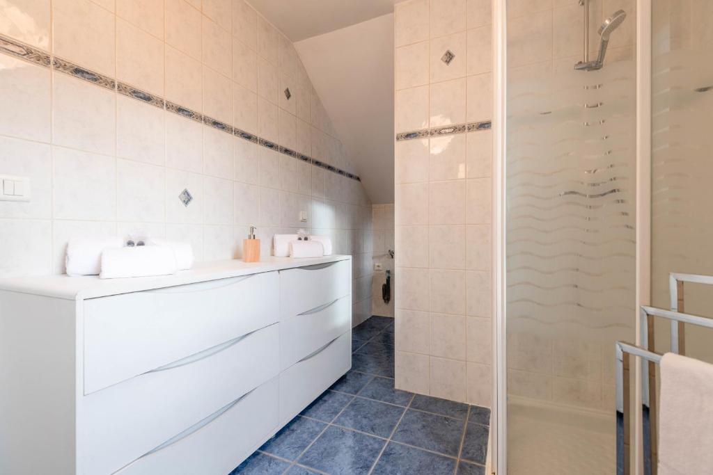 a bathroom with a sink and a shower at Pleasant apartment three minutes from the center of Annecy in Annecy