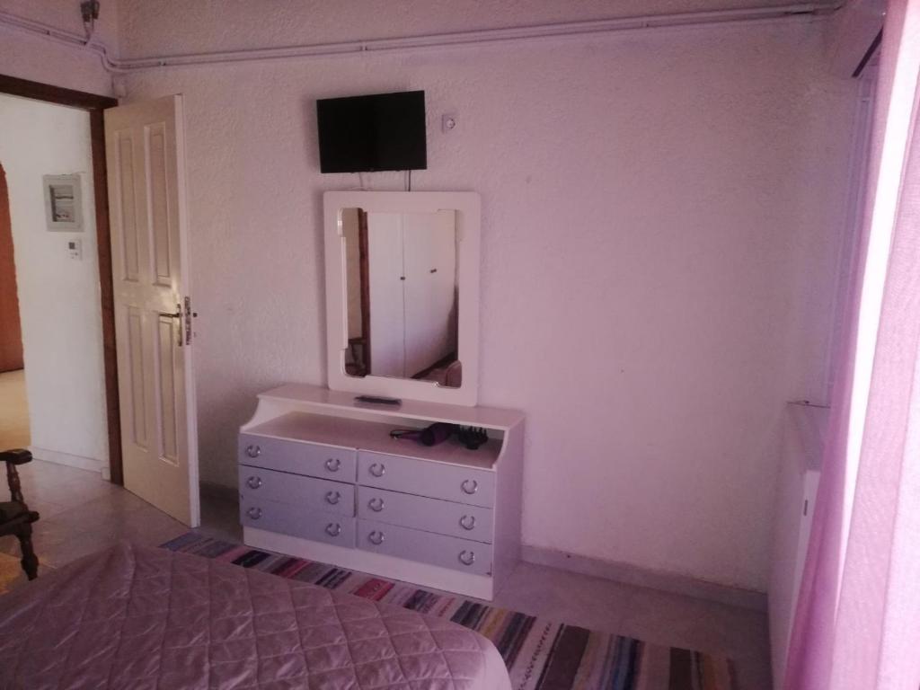 Postel nebo postele na pokoji v ubytování Sunhouse Vrachati