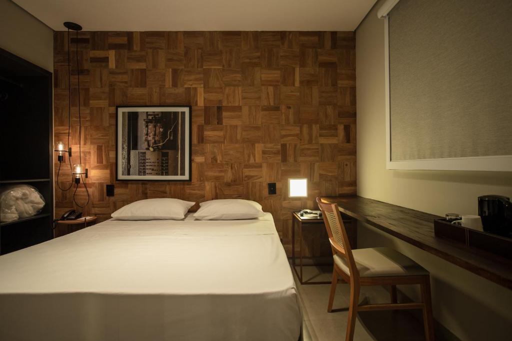 Postel nebo postele na pokoji v ubytování LA HOTEL VOTUPORANGA