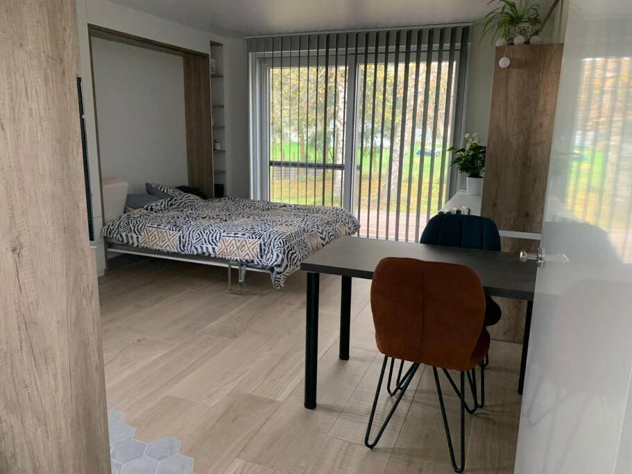 Postel nebo postele na pokoji v ubytování L’annexe