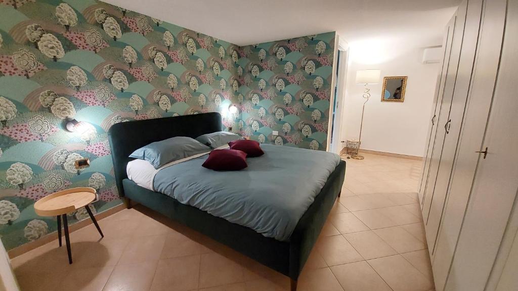 Łóżko lub łóżka w pokoju w obiekcie Maison In Centro