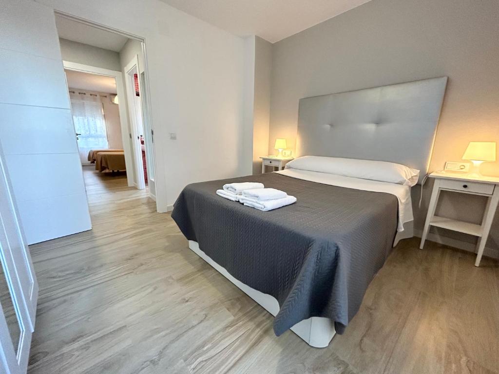 Posteľ alebo postele v izbe v ubytovaní Apartamento Gloria 1 Parking privado gratis