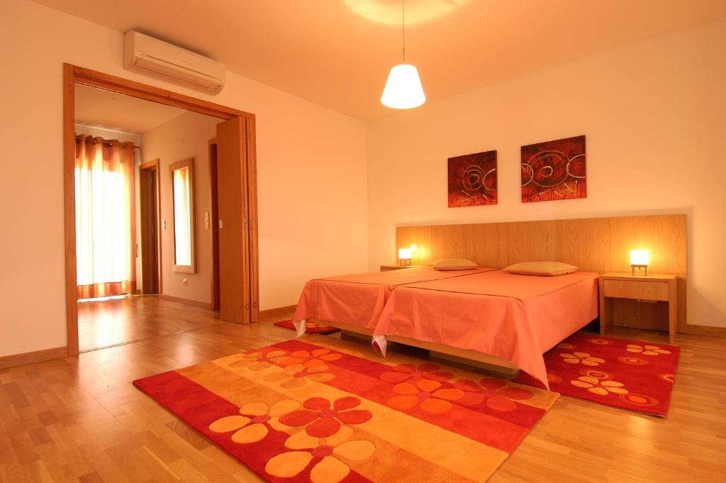 Postel nebo postele na pokoji v ubytování Orada Apartamentos Turísticos - Marina de Albufeira