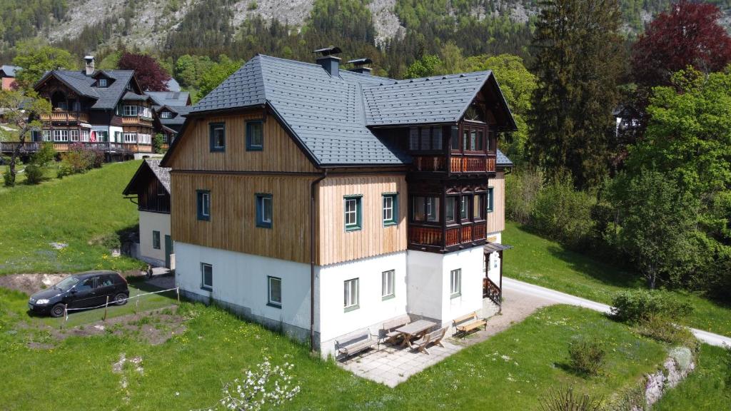 an aerial view of a house with a car in front at Altes Pfarrhaus in Altaussee