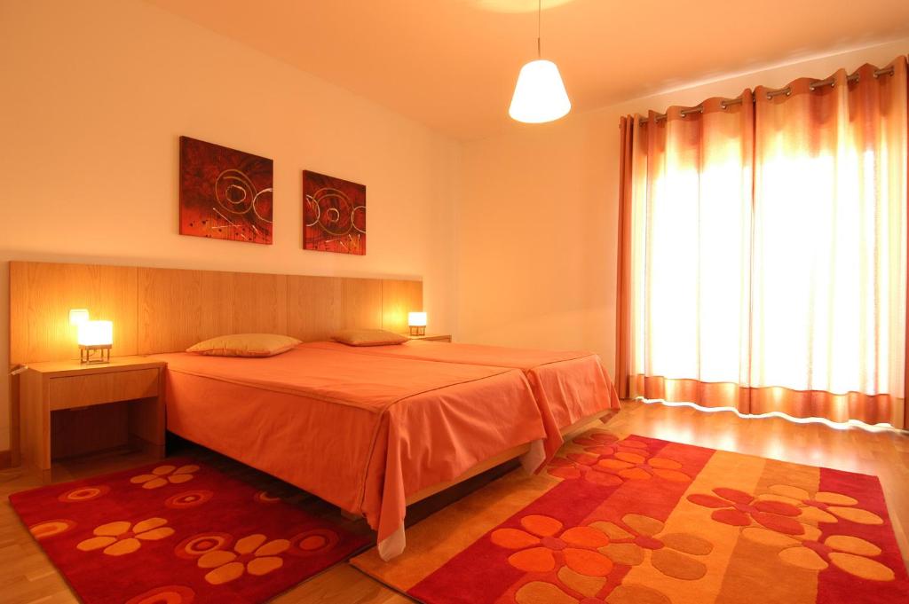 Postel nebo postele na pokoji v ubytování Orada Apartamentos Turísticos - Marina de Albufeira
