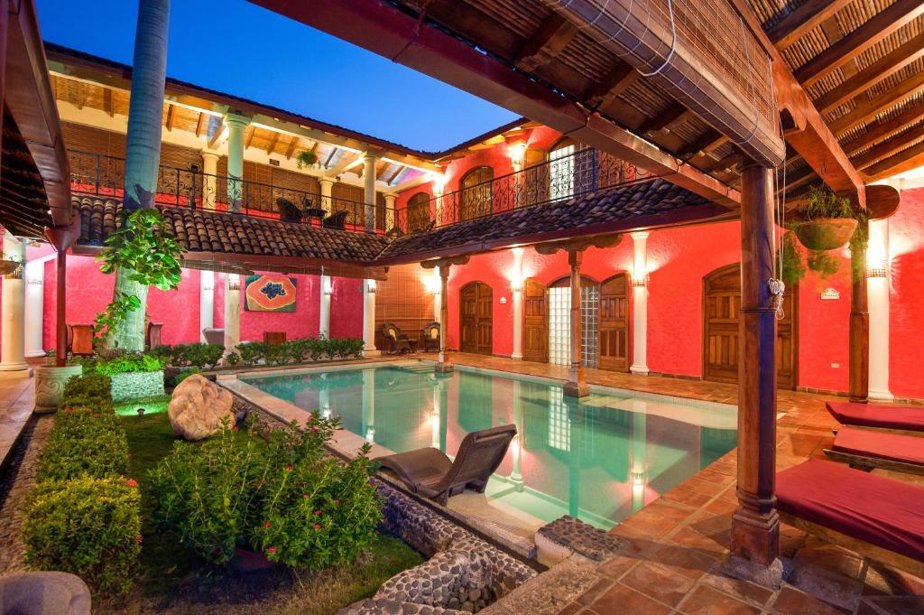 an indoor swimming pool in a house at Hotel Casa del Consulado in Granada