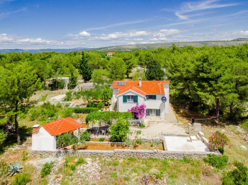 an aerial view of a house with an orange roof at Apartments with a parking space Milna, Brac - 11088 in Milna