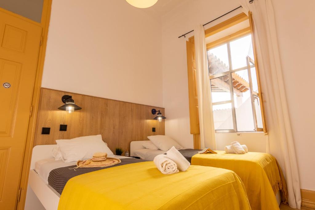 Postel nebo postele na pokoji v ubytování GrowIN Digital Nomads