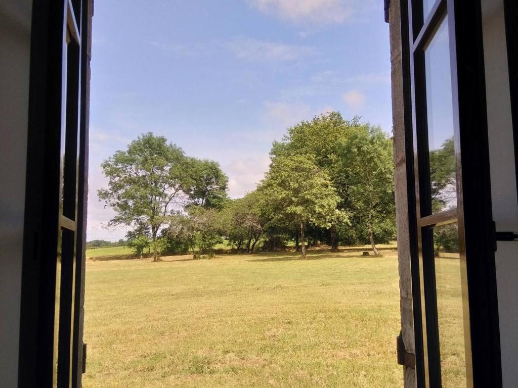 a view of a field from a window at Gîte Arthon, 5 pièces, 8 personnes - FR-1-591-372 in Arthon