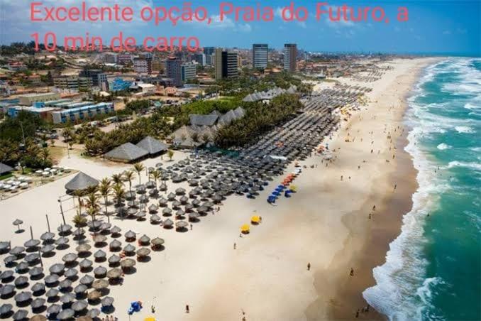 an aerial view of a beach with umbrellas and people at Sol de Iracema centro in Fortaleza