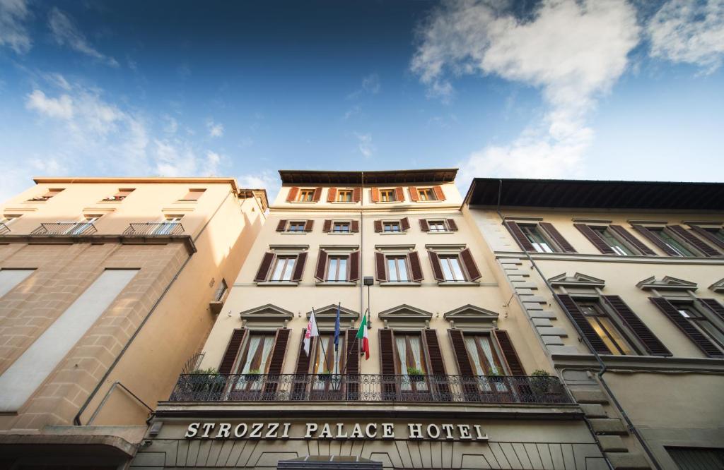 a building with a sign on the front of it at Strozzi Palace Hotel in Florence