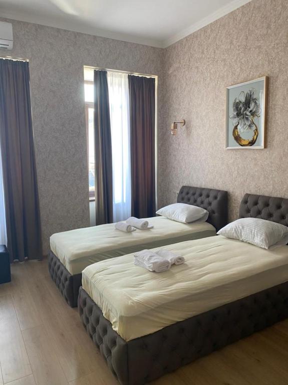 Postel nebo postele na pokoji v ubytování Hotel Guri