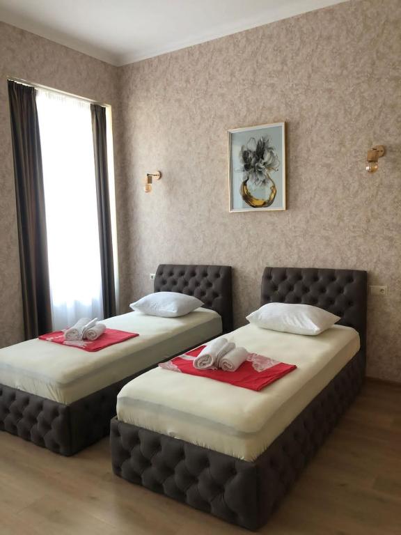 Postel nebo postele na pokoji v ubytování Hotel Guri