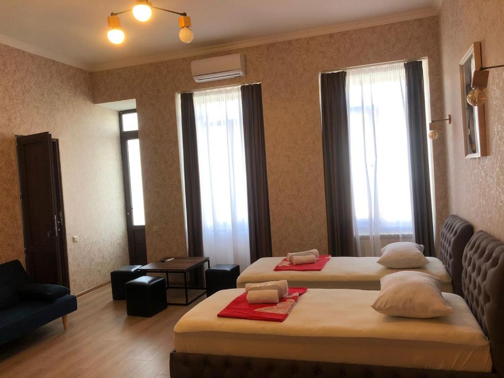 Postel nebo postele na pokoji v ubytování Hotel Guri