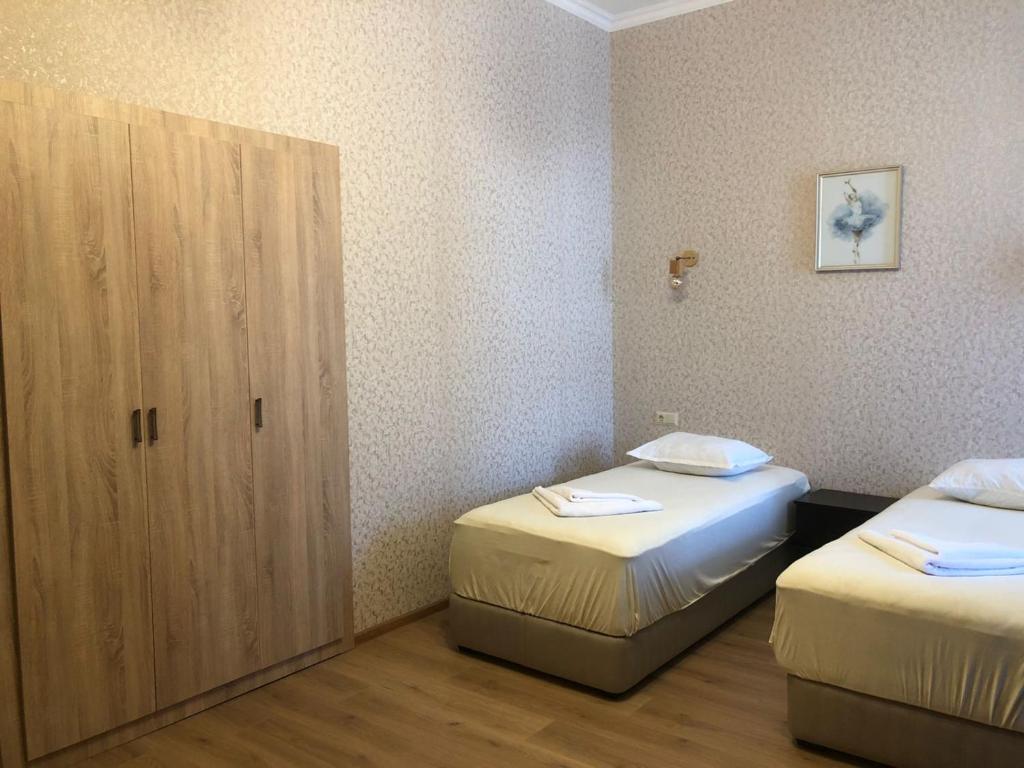 Postel nebo postele na pokoji v ubytování Hotel Guri