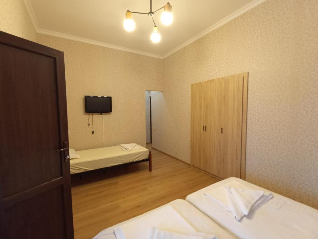 Postel nebo postele na pokoji v ubytování Hotel Guri