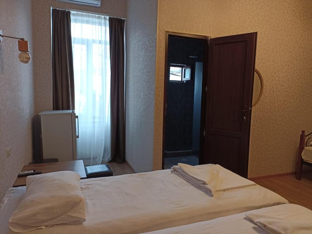 Postel nebo postele na pokoji v ubytování Hotel Guri