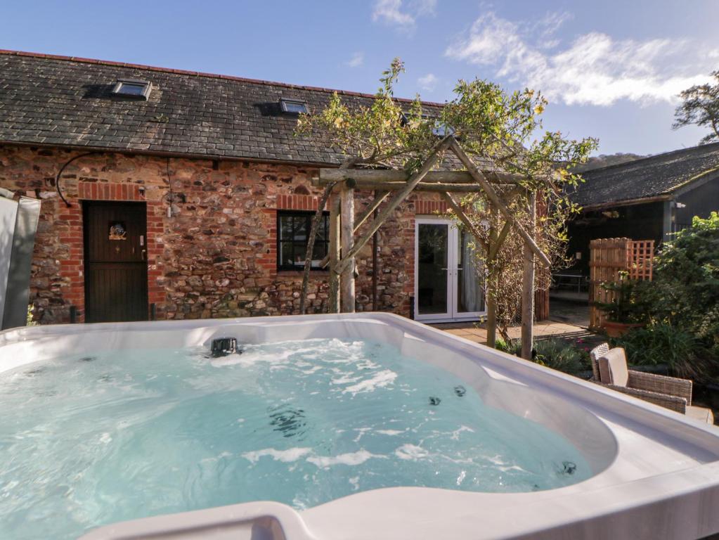 a hot tub in the backyard of a house at The Holt in Sidmouth