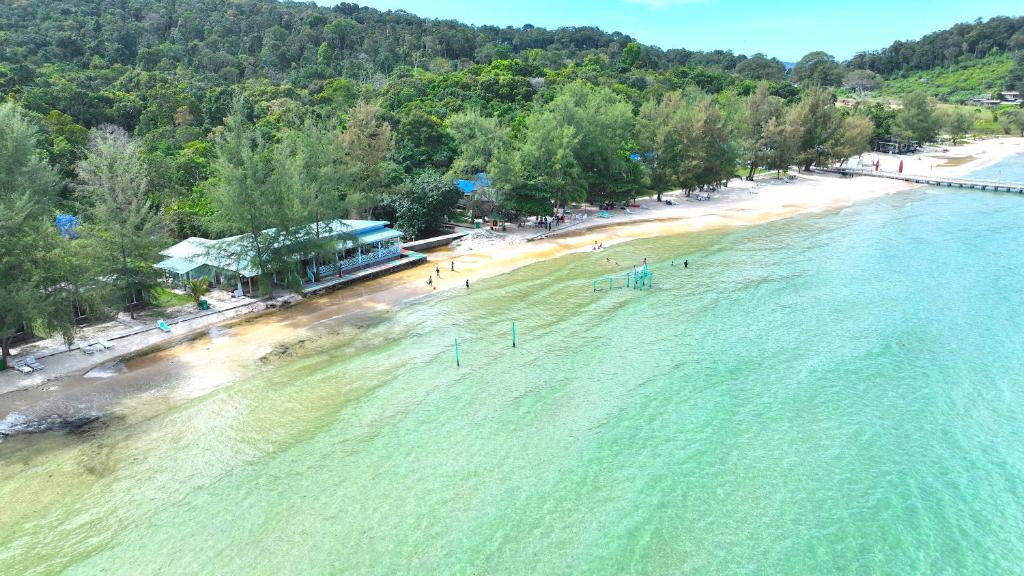 an aerial view of a beach with people in the water at Sandy Beach Bungalows in Koh Rong Sanloem