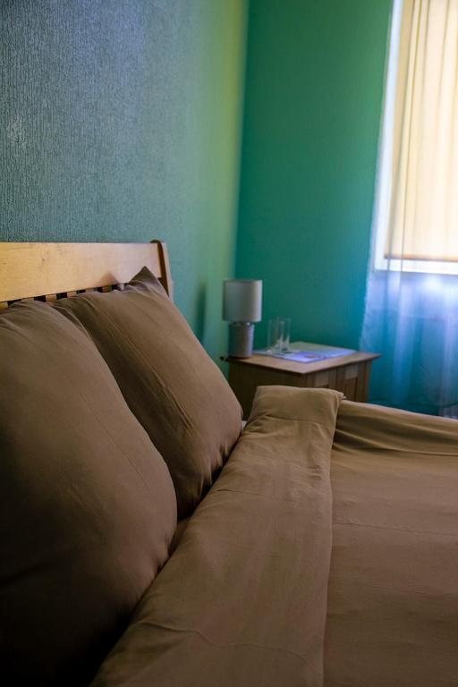 Postel nebo postele na pokoji v ubytování Olimpija Hotel & SPA