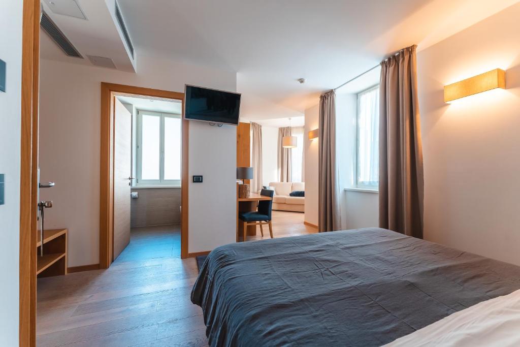 Postel nebo postele na pokoji v ubytování Albergo Caffe Centrale