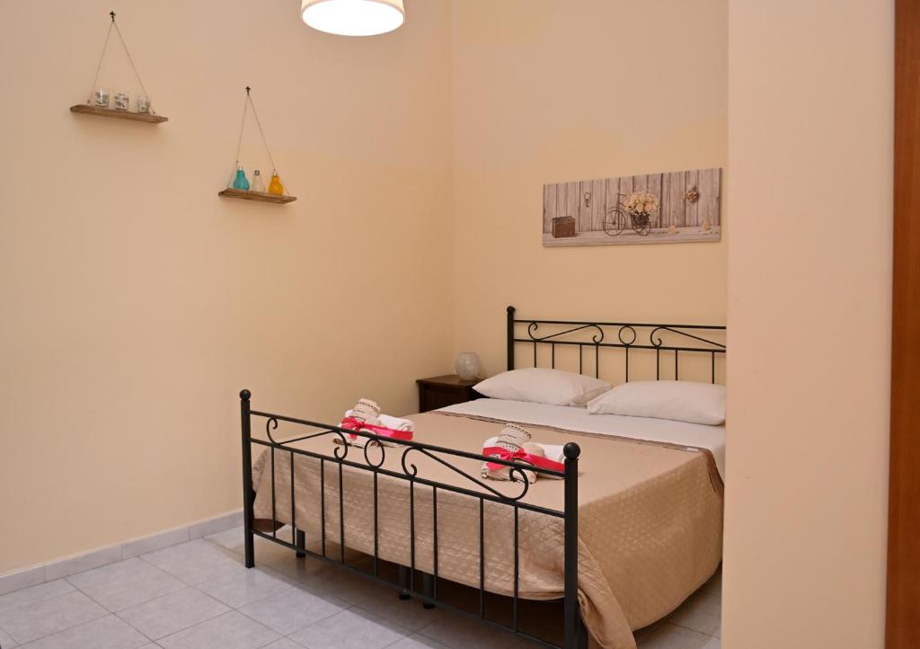 Postel nebo postele na pokoji v ubytování B&B a Capua - I PORTICI del centro