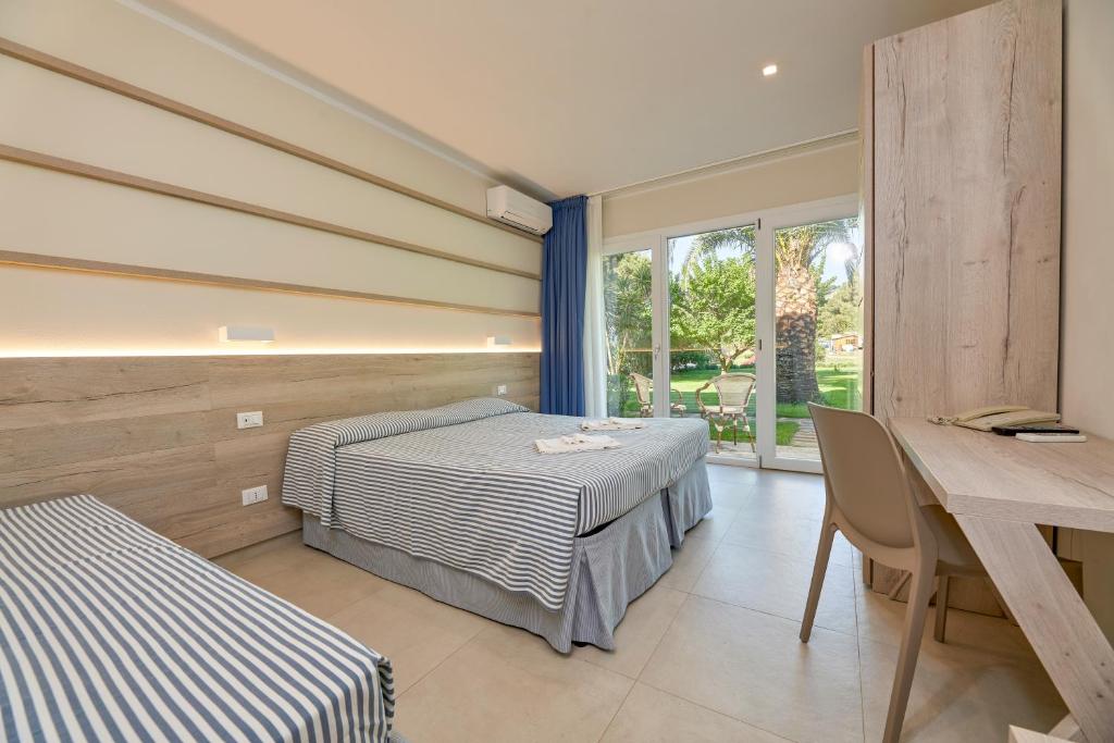 Postel nebo postele na pokoji v ubytování Hotel Villa Rodriguez