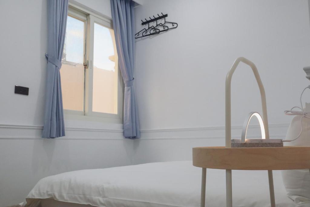 Postel nebo postele na pokoji v ubytování Party& Dream Homestay