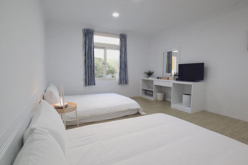 Postel nebo postele na pokoji v ubytování Party& Dream Homestay