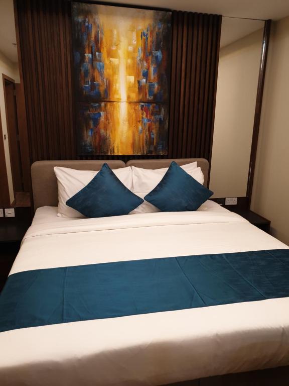 Katil atau katil-katil dalam bilik di Terminal Inn Al Mansoura