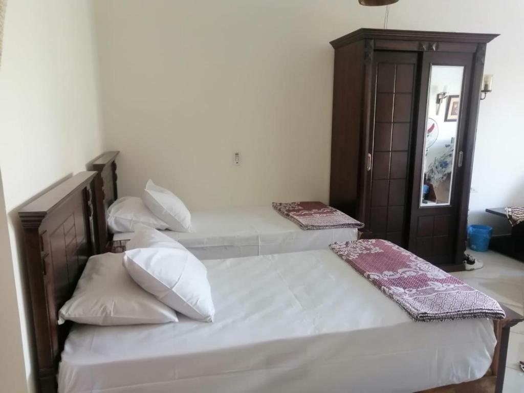 Katil atau katil-katil dalam bilik di Aqua marine - comfort vacation home with pool view