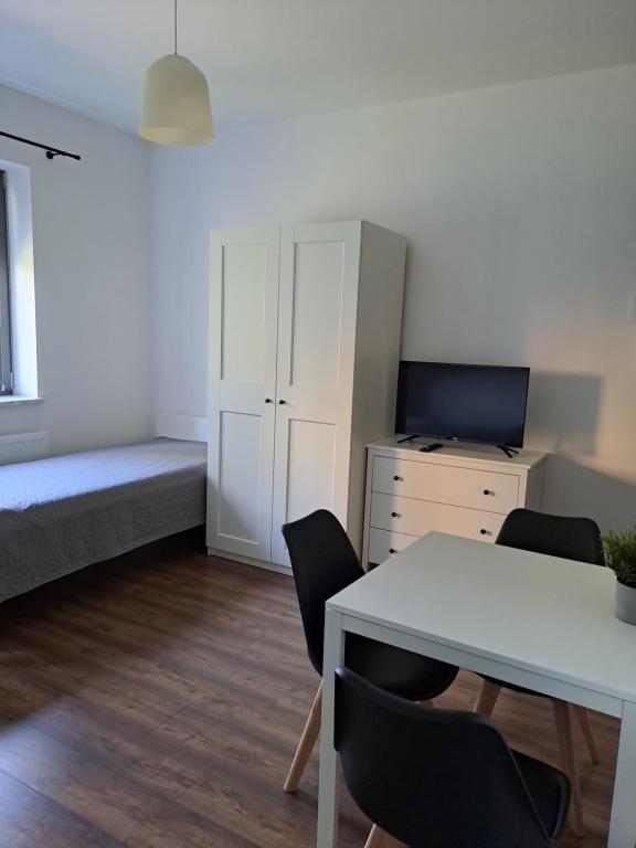 Posteľ alebo postele v izbe v ubytovaní Prokocim Apartments