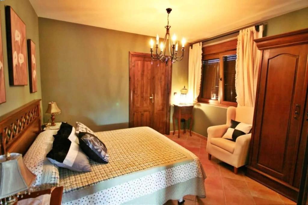 Łóżko lub łóżka w pokoju w obiekcie Casa Os Castelos