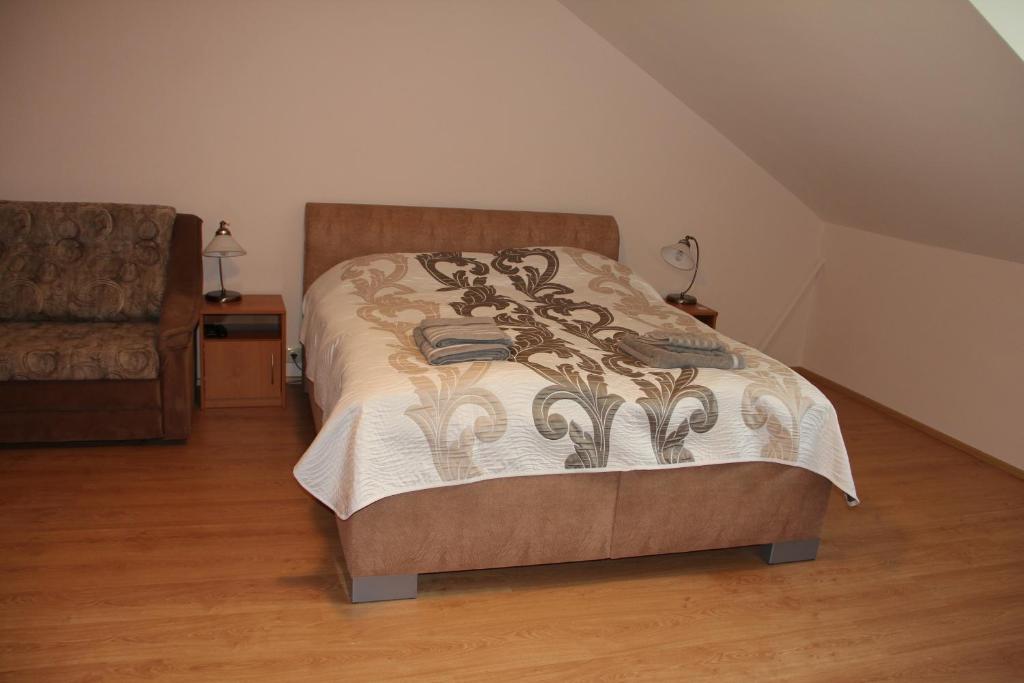 Postel nebo postele na pokoji v ubytování Jurincom apartments
