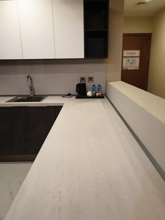 Dapur atau dapur kecil di Terminal Inn Al Mansoura