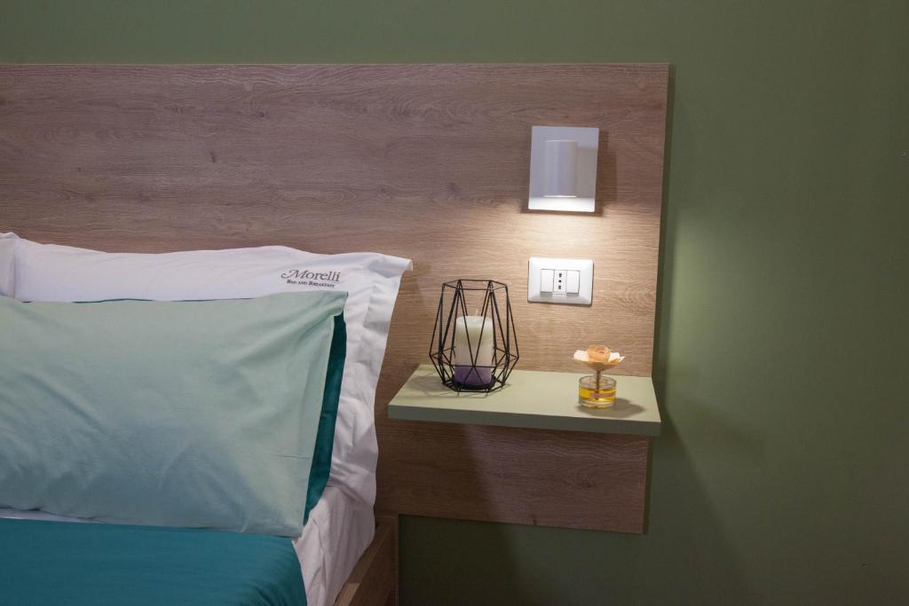 Postel nebo postele na pokoji v ubytování B&B Morelli Home