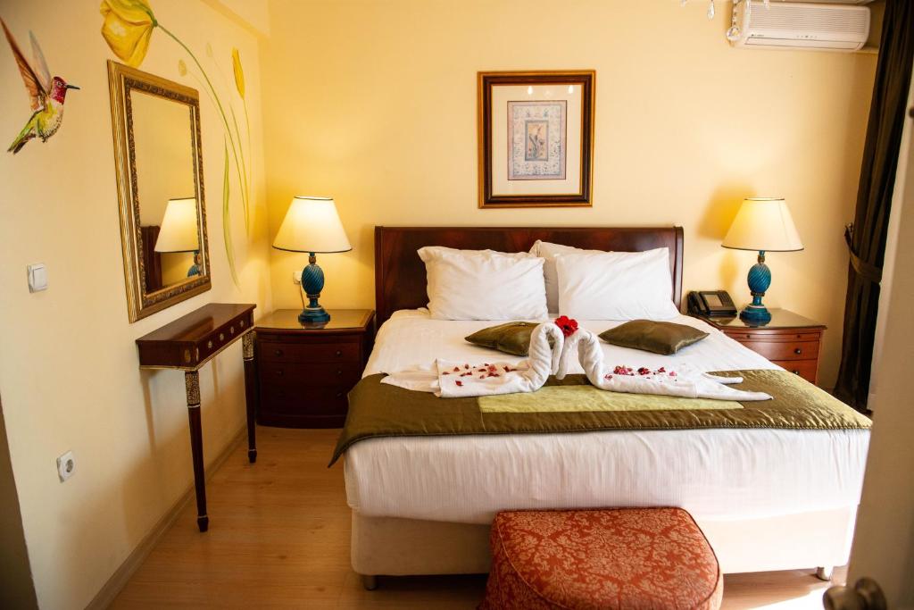 Postel nebo postele na pokoji v ubytování Hotel Simsek