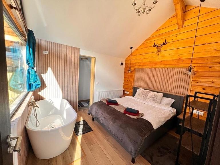 Postel nebo postele na pokoji v ubytování View Piatra Craiului