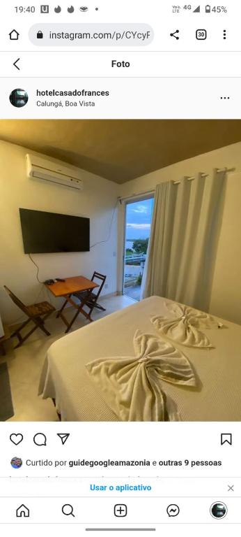 a picture of a bedroom with a bed and a window at hotel Casa do Francês na Praia in Boa Vista
