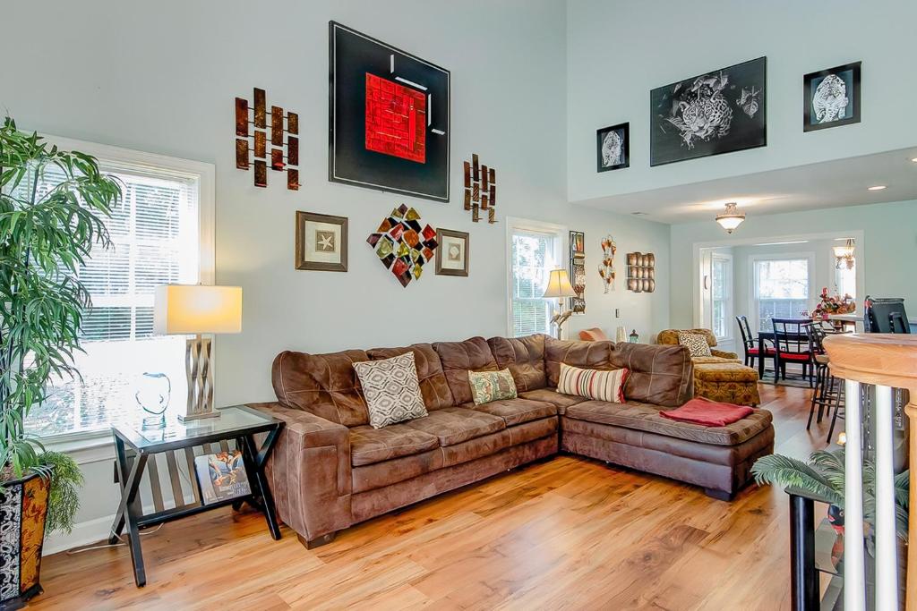 a living room with a couch and a table at Palm Oaks Estate in Myrtle Beach