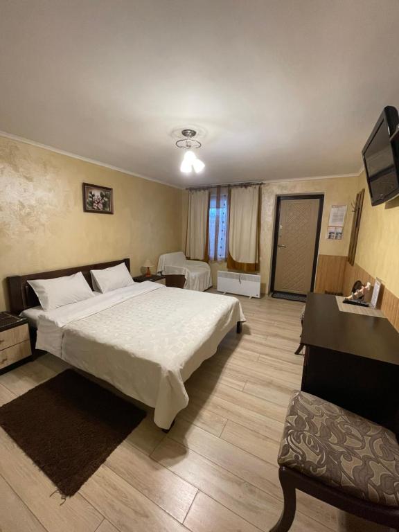 Postel nebo postele na pokoji v ubytování Guest House SunRise