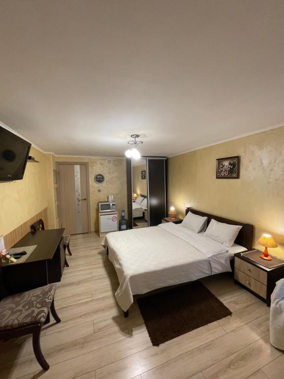 Postel nebo postele na pokoji v ubytování Guest House SunRise