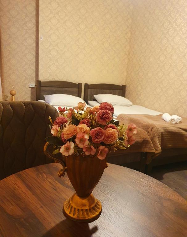 Postel nebo postele na pokoji v ubytování Nikolo Inn