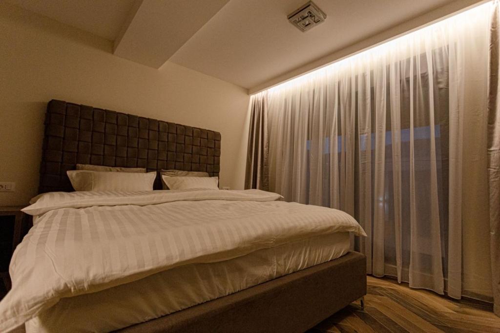 Postel nebo postele na pokoji v ubytování Perla Lux apartmani